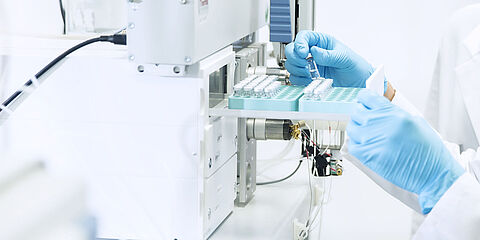 Performing food analysis in the laboratory: laboratory technicians during the examination for residues and contaminants